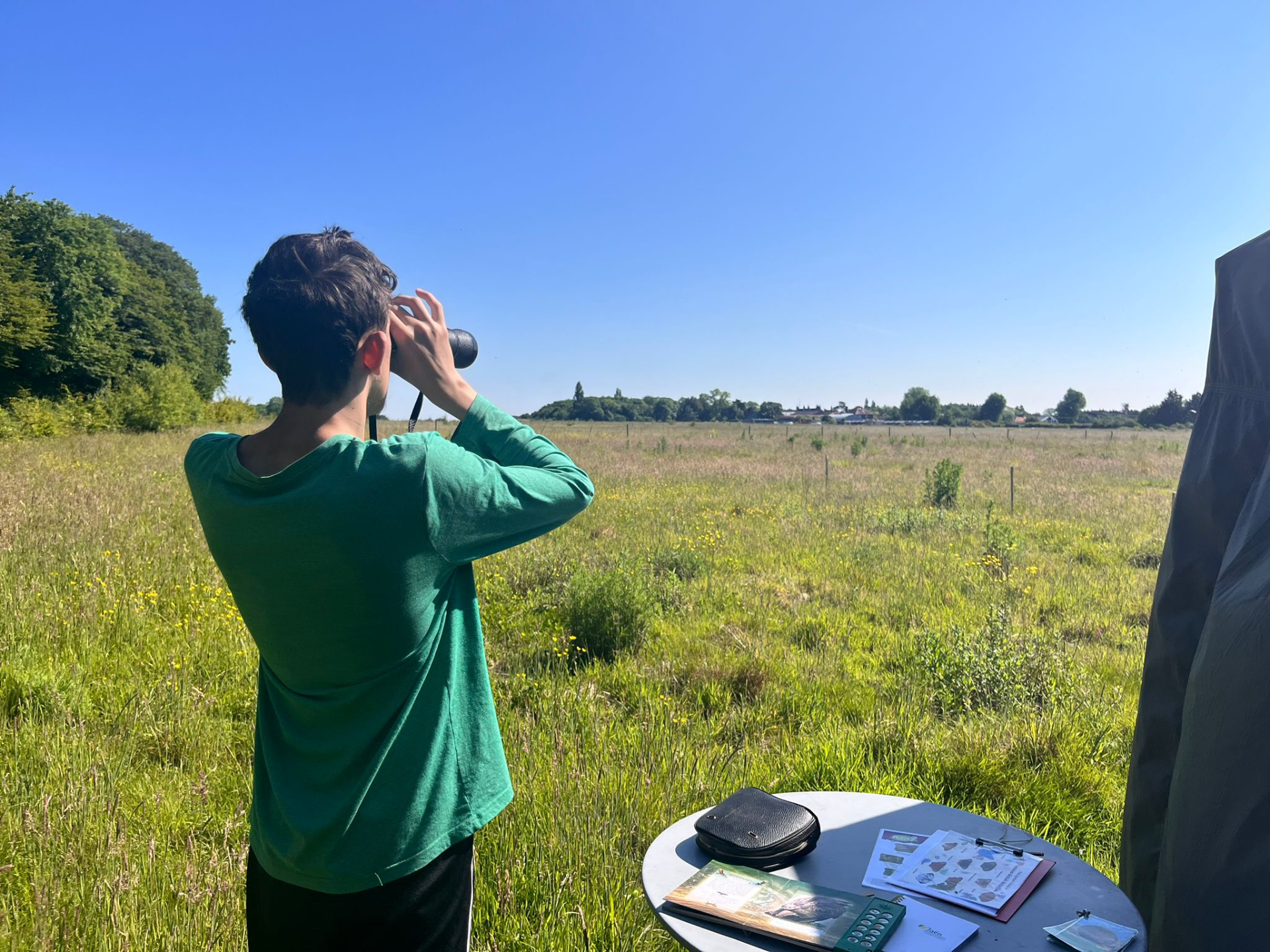 Child engaged in purposeful outdoor activity at Maypole Farm